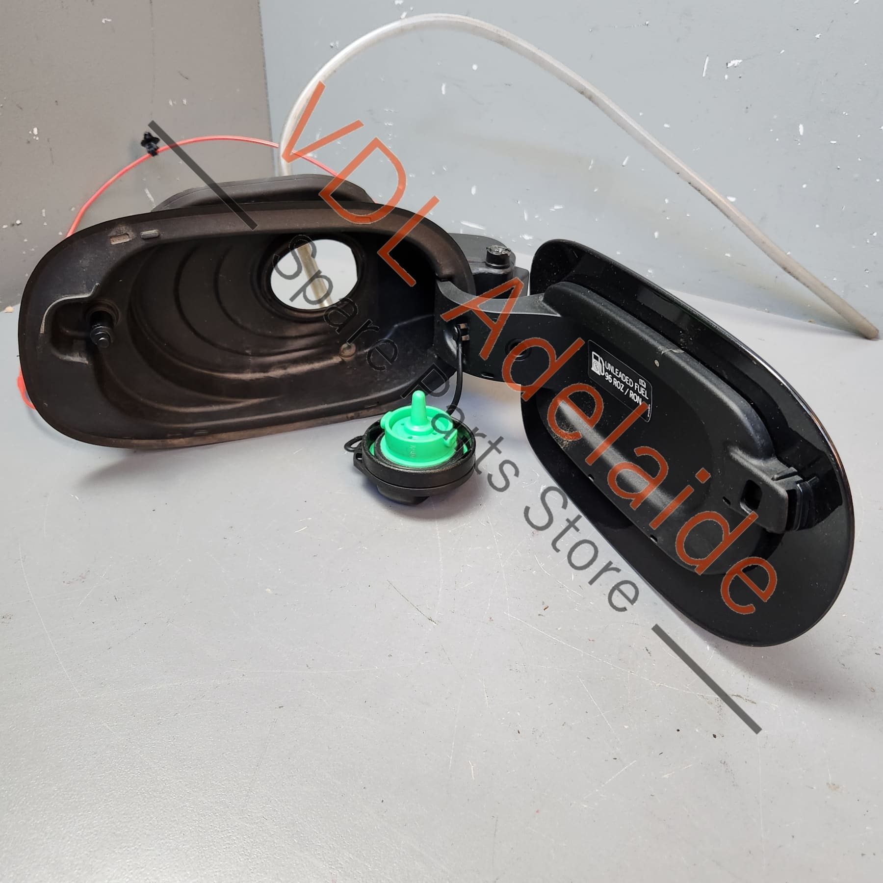 Porsche Panamera 971 Fuel Filler Flap Door with Lock Actuator 974809857 974809857      One of four retaining clips broken