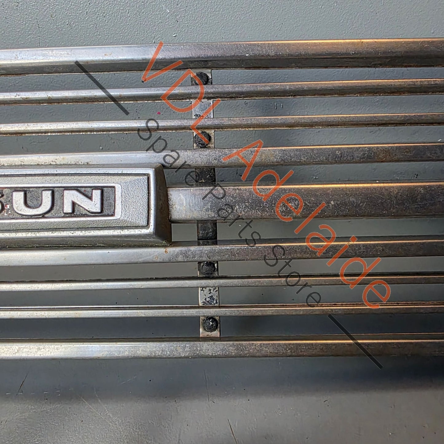 Datsun 1600 510 1968 Front Grille & Headlight Trims Complete with Centre Badge