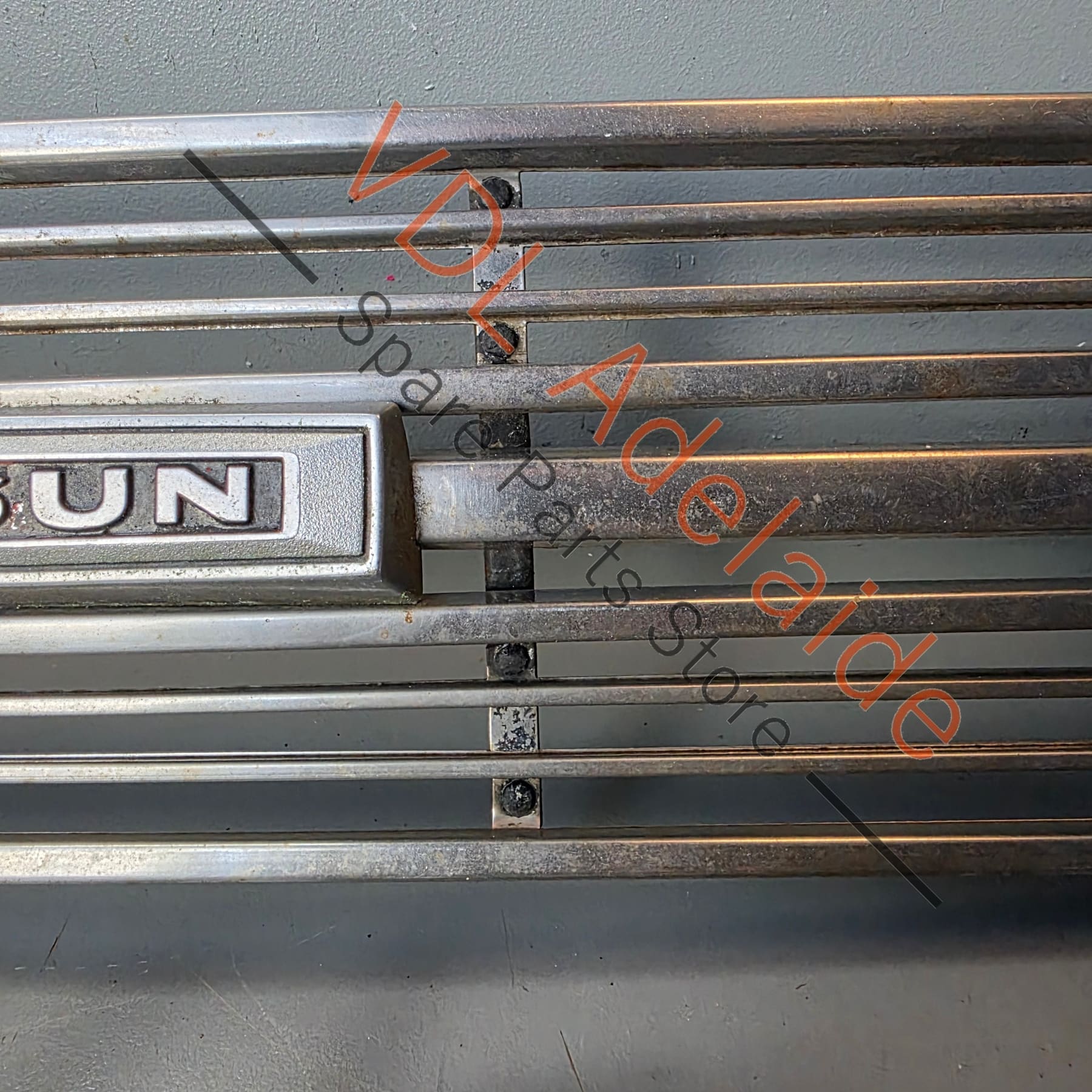 Datsun 1600 510 1968 Front Grille & Headlight Trims Complete with Centre Badge