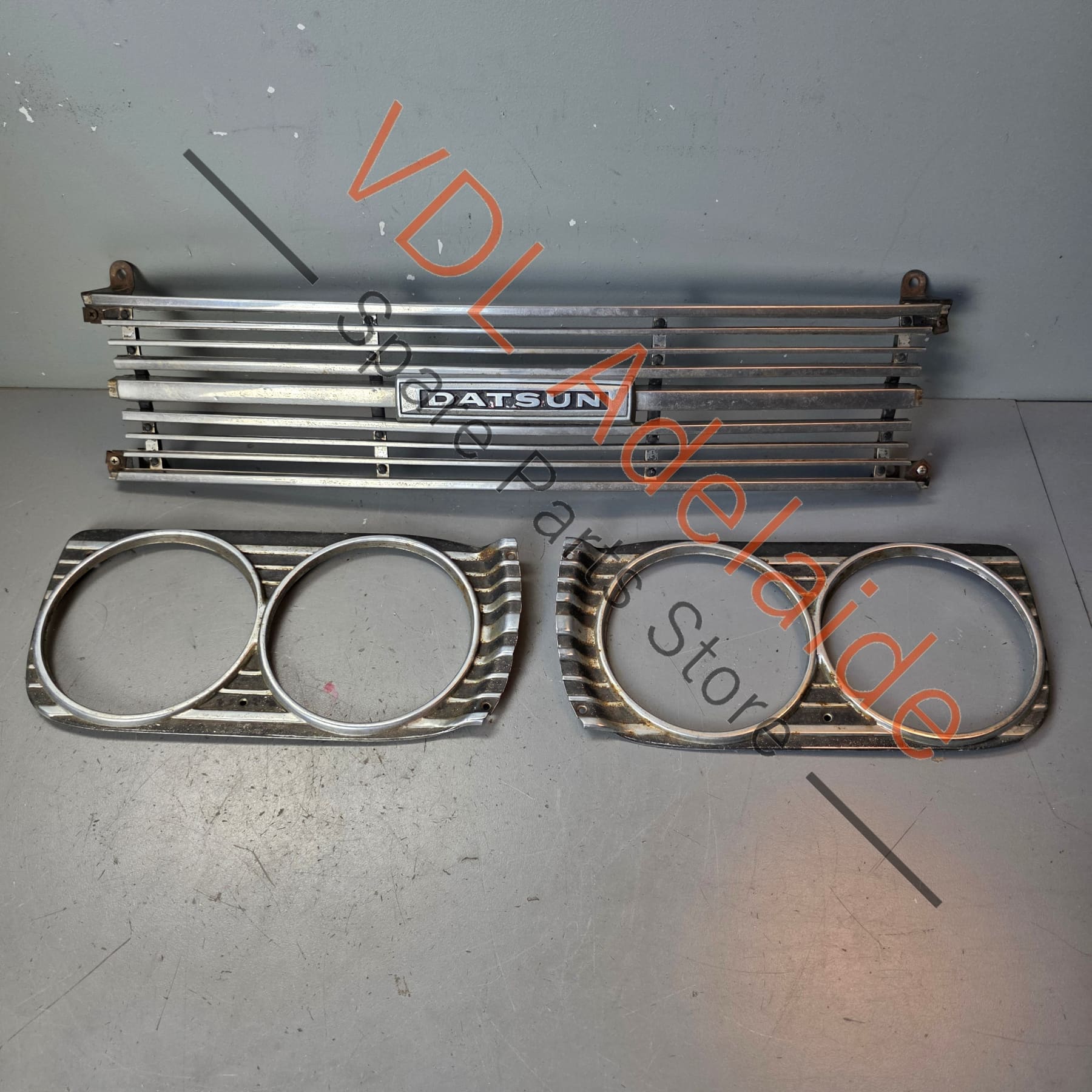 Datsun 1600 510 1968 Front Grille & Headlight Trims Complete with Centre Badge