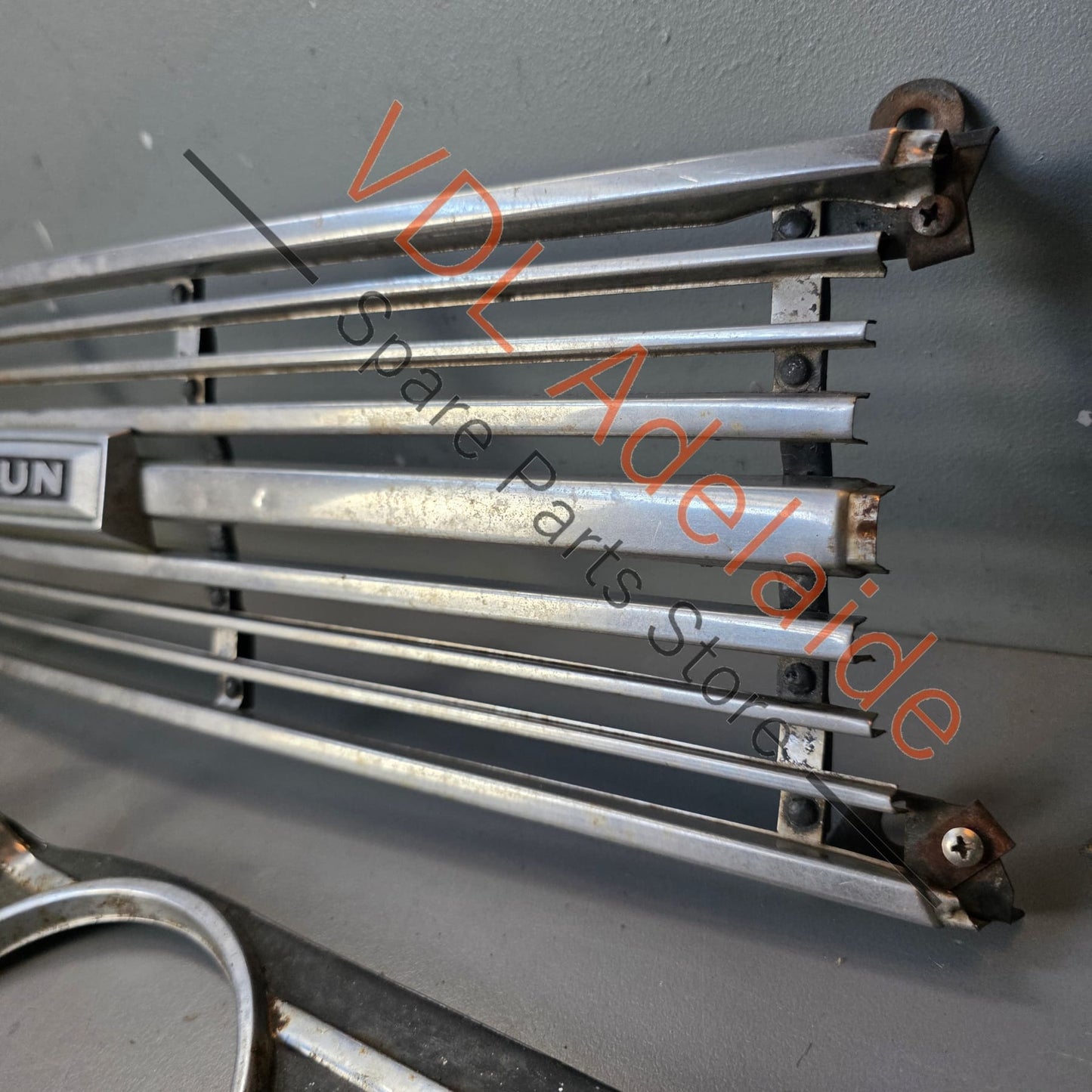 Datsun 1600 510 1968 Front Grille & Headlight Trims Complete with Centre Badge