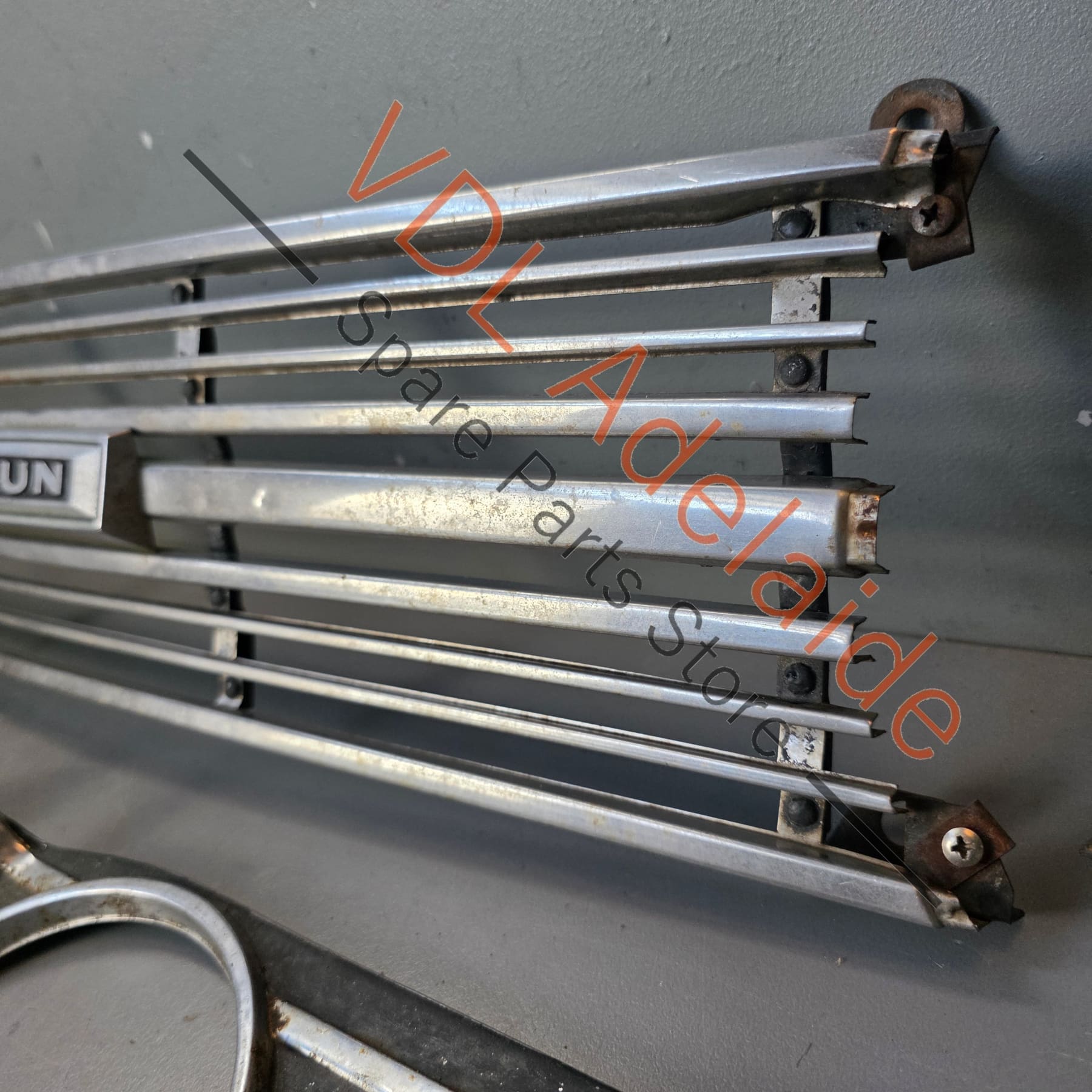 Datsun 1600 510 1968 Front Grille & Headlight Trims Complete with Centre Badge