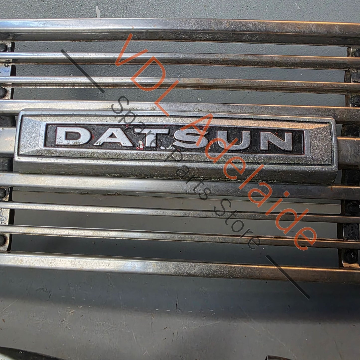 Datsun 1600 510 1968 Front Grille & Headlight Trims Complete with Centre Badge