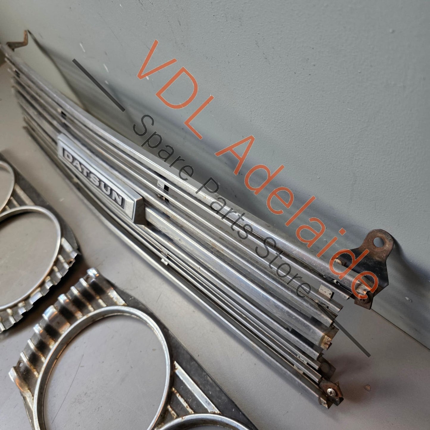 Datsun 1600 510 1968 Front Grille & Headlight Trims Complete with Centre Badge