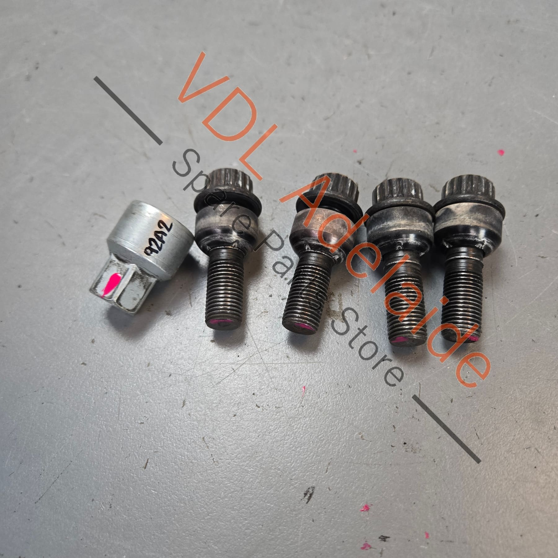 971698030B    Genuine Anti Theft Porsche Cayenne 958 Set of Wheel Lock Nuts with Key Black 971698030B